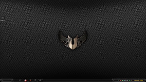 Asus TUF Gaming Laptop Lid with Metallic Emblem on Carbon Fiber Texture HD wallpaper