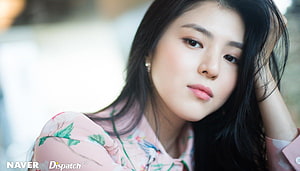 Han So Hee in a Soft Pink Floral Blouse with Natural Makeup and Long Dark Hair HD wallpaper
