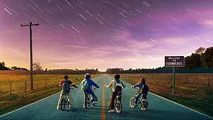 Stranger Things Kids Riding Bikes Down Road With Star Trails And Hawkins Sign HD wallpaper