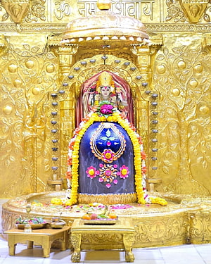 Somnath Mahadev Jyotirlinga Temple Golden Shrine with Flower Offerings and Sacred Idol HD phone wallpaper