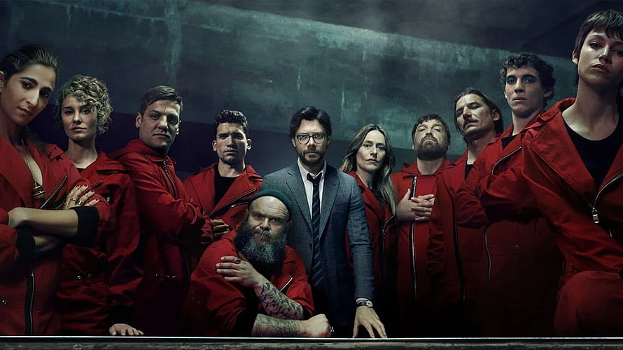 Money Heist Cast in Red Jumpsuits and Grey Suit Against Dark Industrial Backdrop HD wallpaper