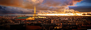 Eiffel Tower and Paris Cityscape at Golden Hour with Dramatic Sunset Sky HD wallpaper