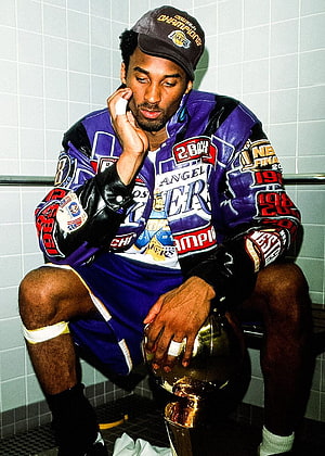 Kobe Bryant Sitting With NBA Championship Trophy In Locker Room HD phone wallpaper