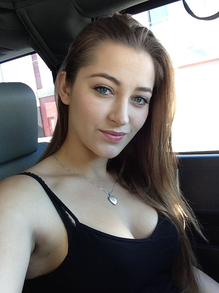 Young woman with long brown hair and blue eyes wearing a black top and heart pendant necklace inside a car, CHADA, danny daniel HD phone wallpaper