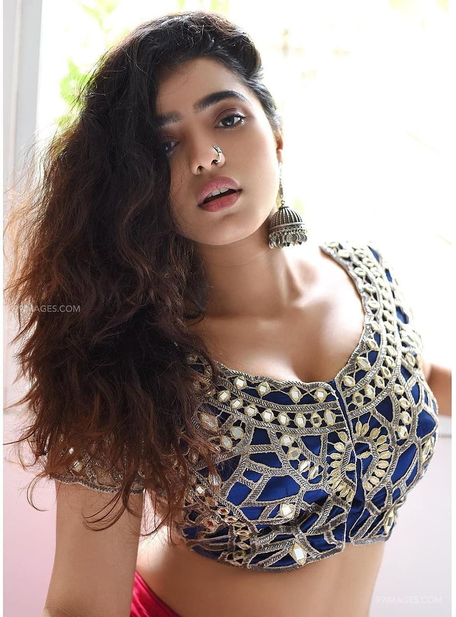 Kethika Sharma in an ornate blue and gold embroidered blouse with traditional Indian jewelry HD phone wallpaper