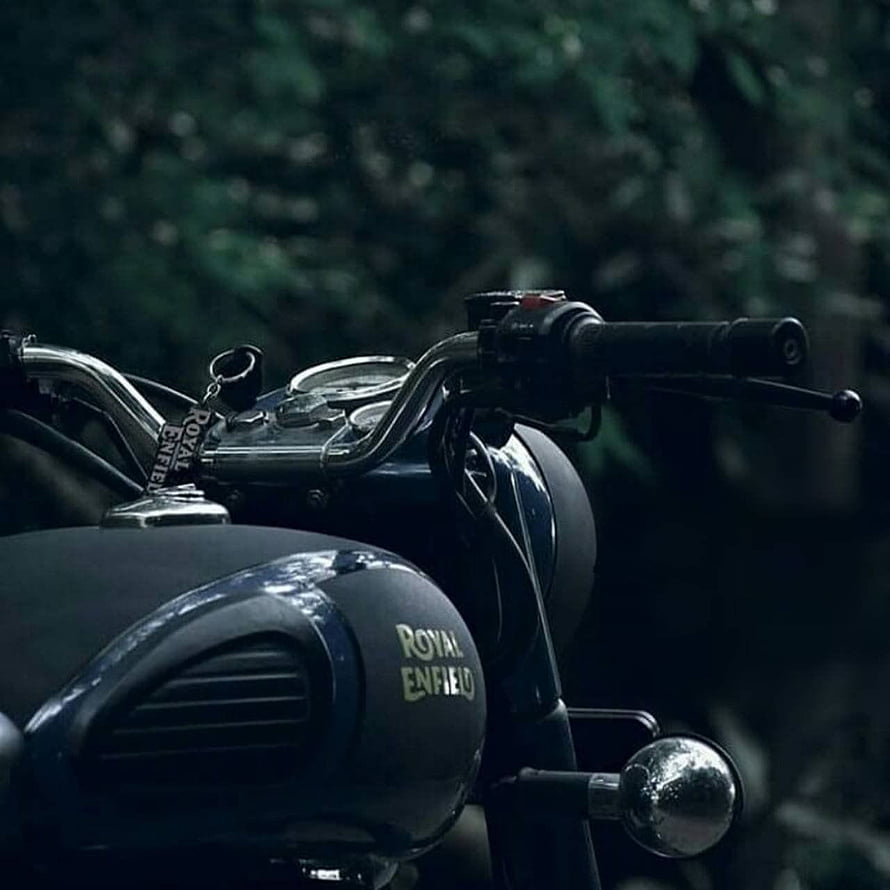 Royal Enfield Classic Motorcycle Handlebar and Tank Detail in Dark Forest Setting HD phone wallpaper