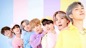 BTS Group Portrait in Pastel Colors Against Striped Background HD wallpaper
