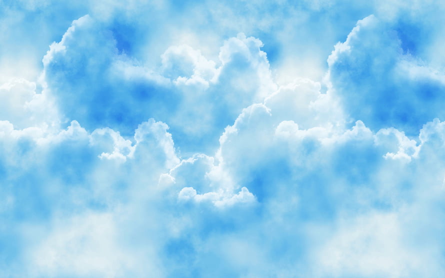 Serene White Clouds Drifting Across a Bright Blue Sky HD wallpaper