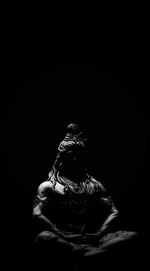 Dark Monochrome Statue of Meditating Hindu Deity in Shadow HD phone wallpaper