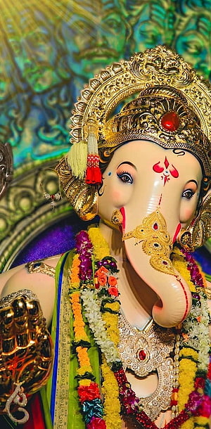Ganesha Idol With Golden Crown And Flower Garlands HD phone wallpaper
