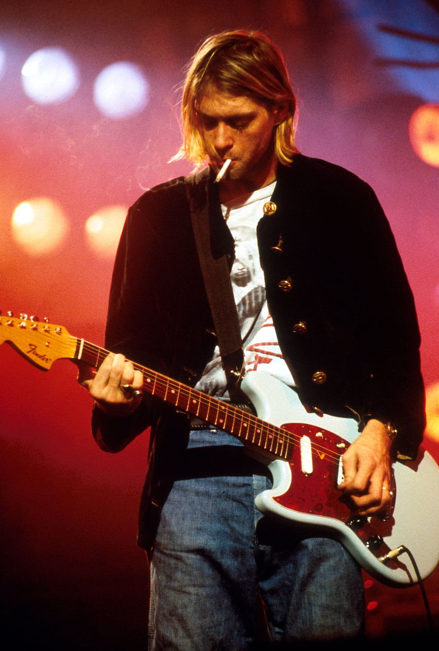 Kurt Cobain playing Fender guitar on stage with cigarette in mouth HD phone wallpaper