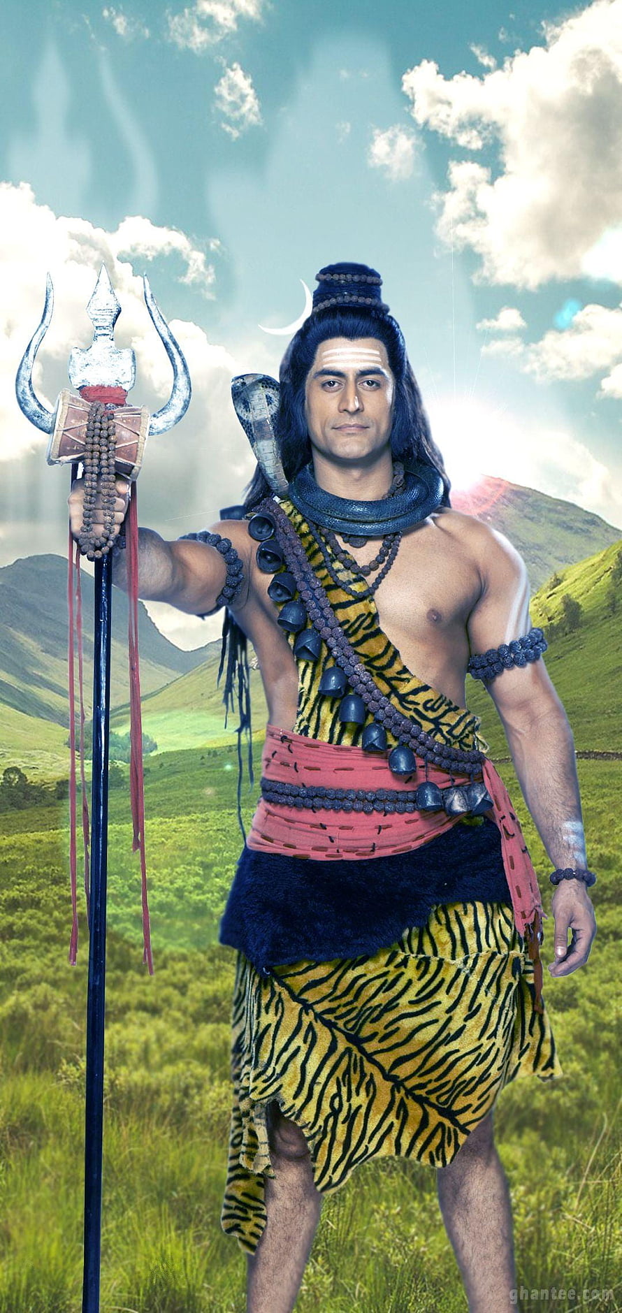 Lord Shiva standing in green mountains holding trident with snake around neck HD phone wallpaper