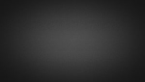 Dark Gray Textured Background With Subtle Grain And Vignette Effect For Desktop HD wallpaper