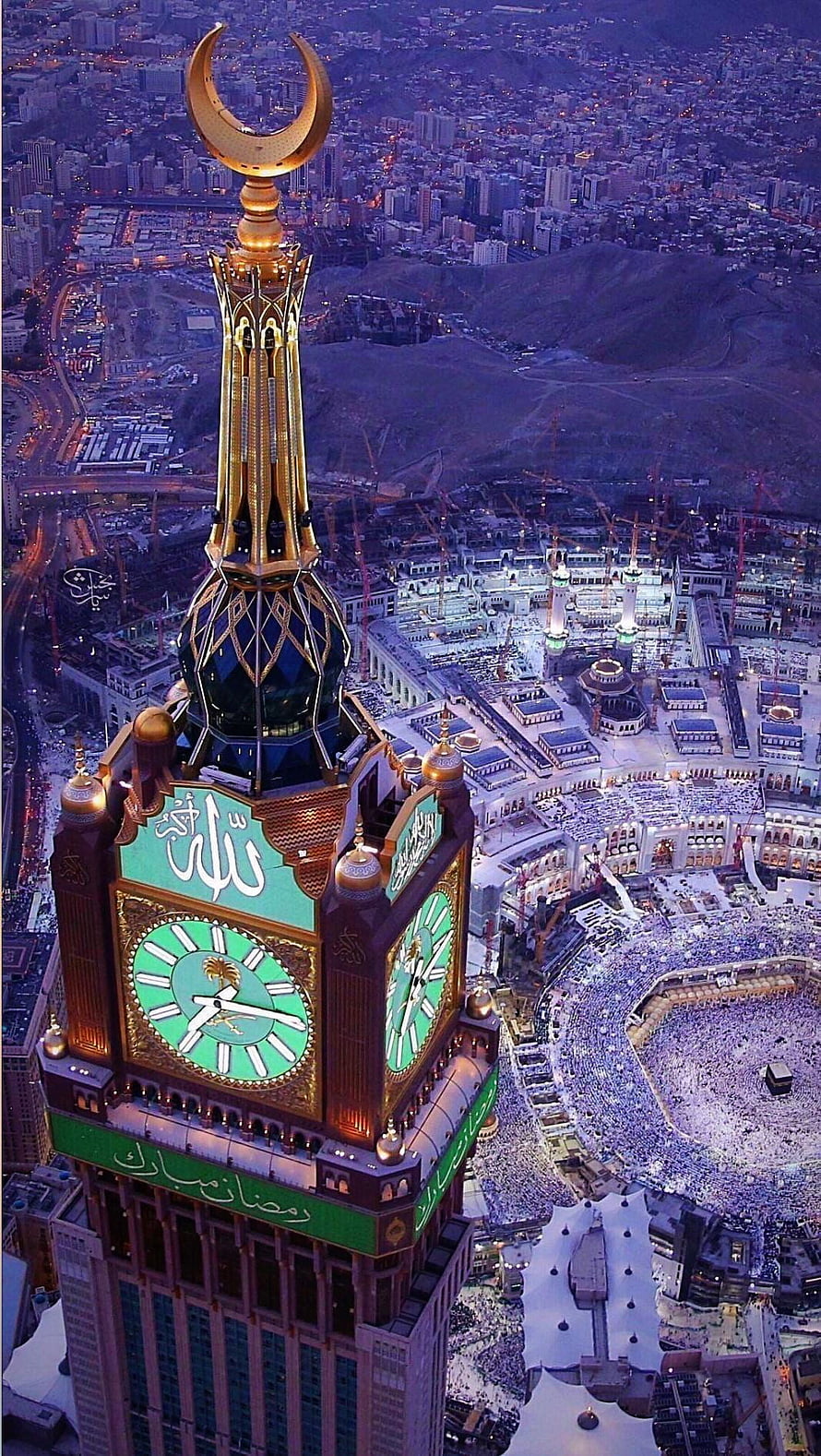 Abraj Al Bait Clock Tower overlooking the illuminated Kaaba and Grand Mosque in Mecca at night HD phone wallpaper