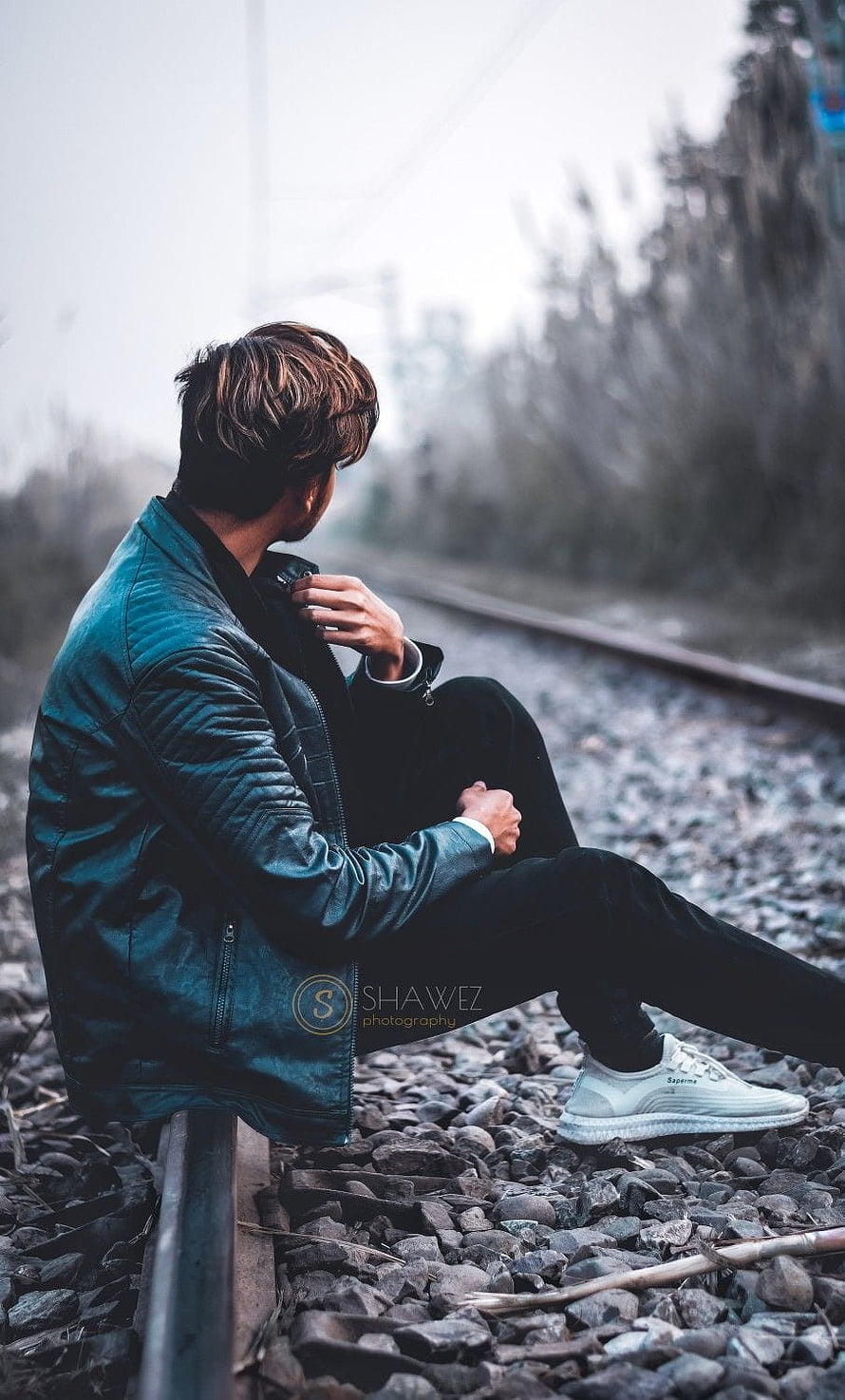 Man in Teal Leather Jacket Sitting on Train Tracks, Boys dp, sad pose boy HD phone wallpaper