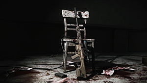Escape From Tarkov Tactical Rifle Leaning Against Blood-Stained Chair in Dark Room HD wallpaper