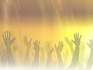 Silhouettes of Raised Hands Against Golden Light Rays HD wallpaper