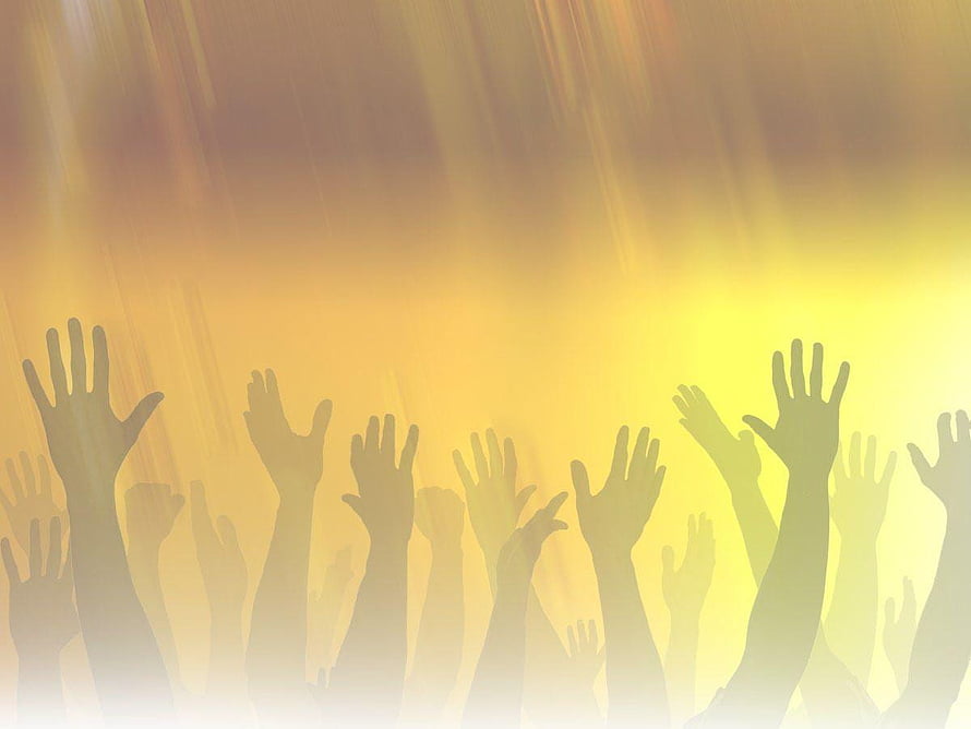 Silhouettes of Raised Hands Against Golden Light Rays HD wallpaper