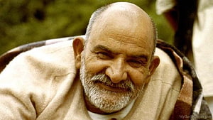 Portrait of a smiling elderly man with a white beard and bald head wearing a beige sweater, Neem Karoli Baba JI, #neem karoli baba HD wallpaper
