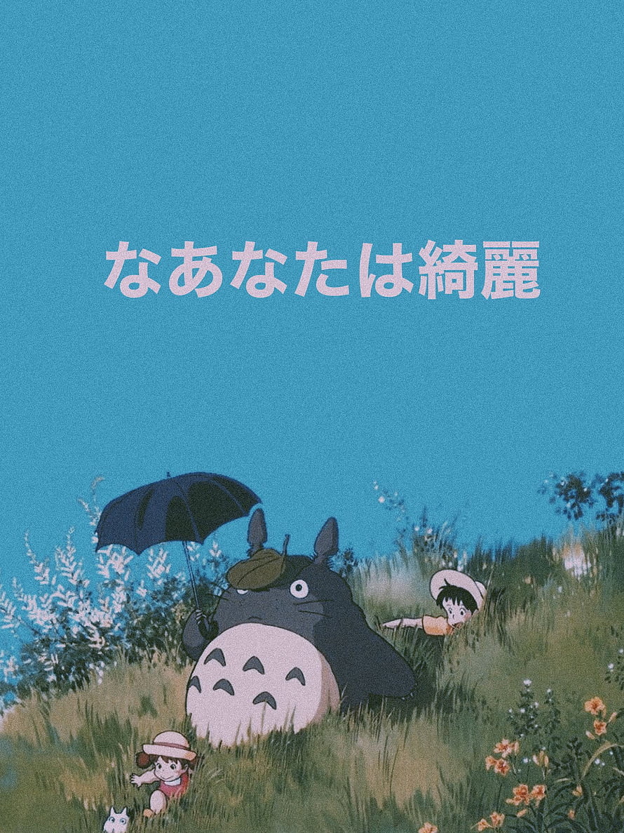 My Neighbor Totoro in a grassy field with children and an umbrella under a blue sky HD phone wallpaper
