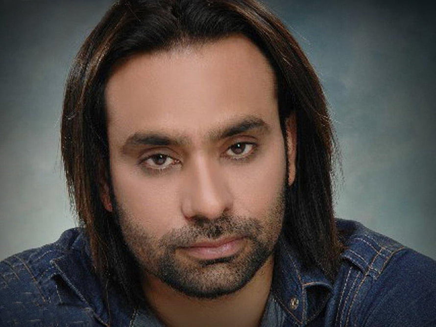 Babbu Maan Portrait: Punjabi Singer in Denim Shirt with Long Hair and Beard HD wallpaper