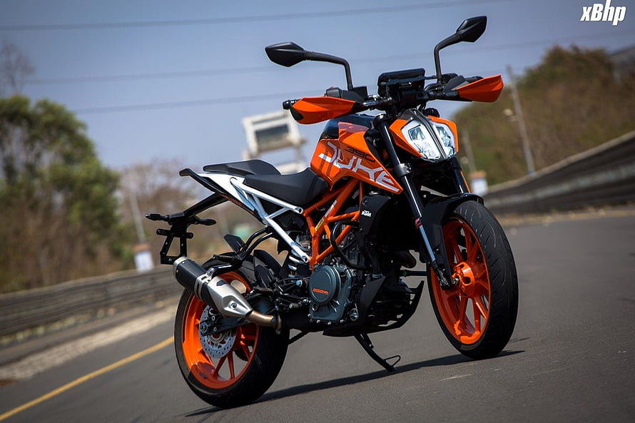 KTM 390 Duke Orange Naked Motorcycle Parked on Open Road HD wallpaper