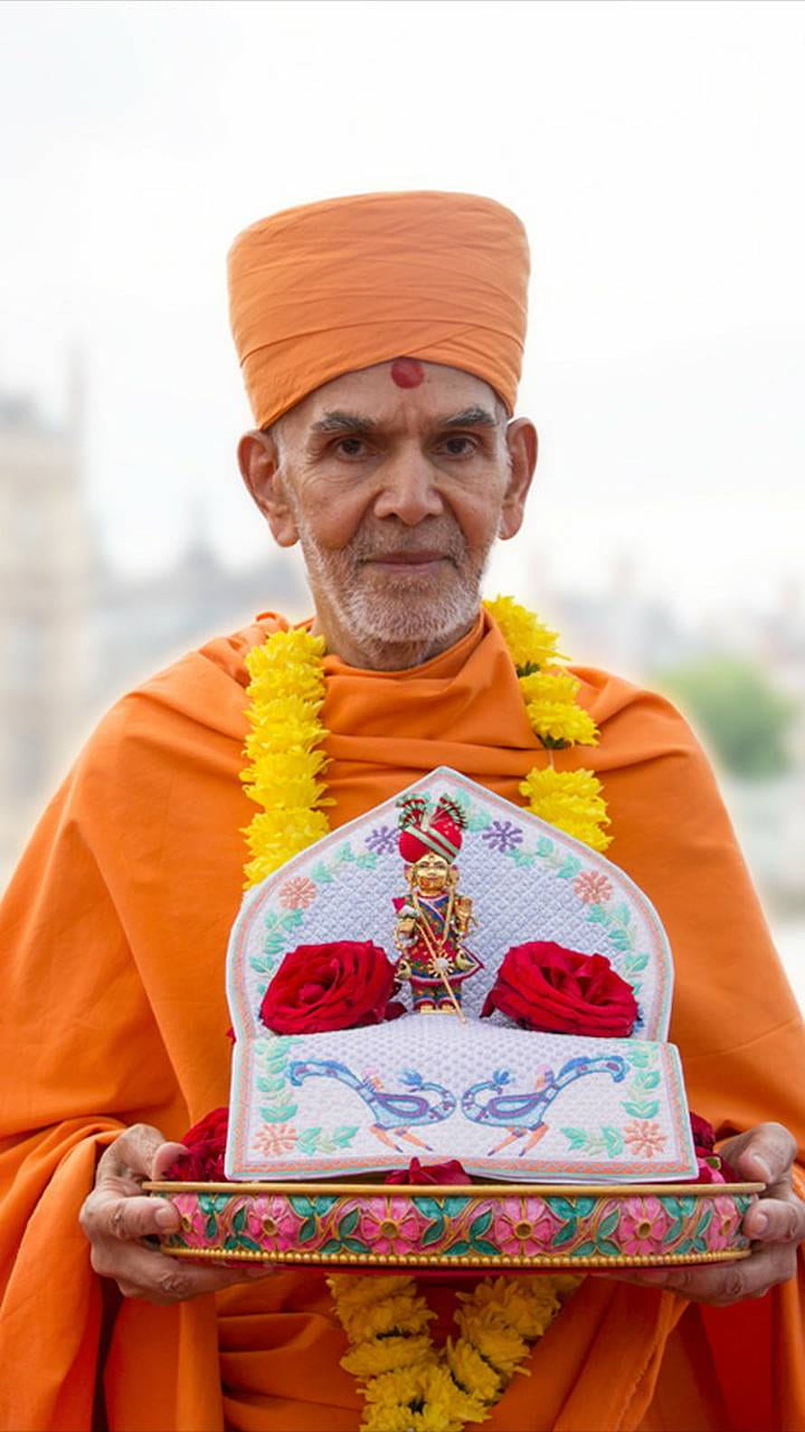 Mahant Swami Maharaj in Orange Saffron Robes Holding Decorative Pooja Thali HD phone wallpaper