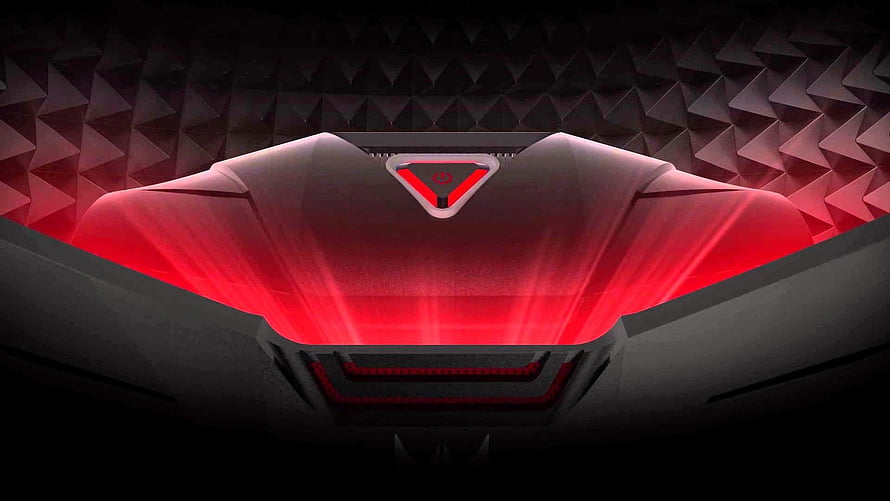 Red Alienware Gaming Laptop Lid with Glowing Logo and Geometric Background HD wallpaper