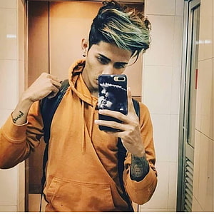 Young Man With Dyed Green Hair Taking A Mirror Selfie In An Orange Hoodie, Danish Zehen, danish zhen HD phone wallpaper
