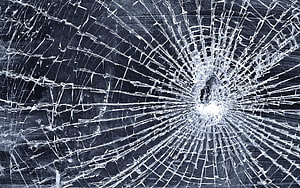 Shattered Glass Texture With Radiating Fracture Lines And Central Impact Point HD wallpaper