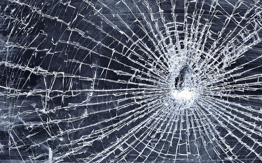Shattered Glass Texture With Radiating Fracture Lines And Central Impact Point HD wallpaper