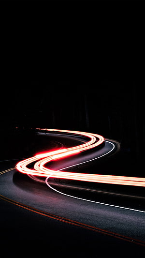 Long Exposure Red Light Trails on a Winding Night Road HD phone wallpaper