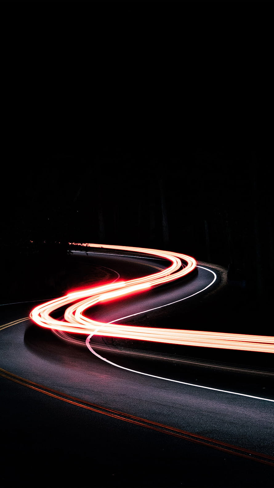 Long Exposure Red Light Trails on a Winding Night Road HD phone wallpaper