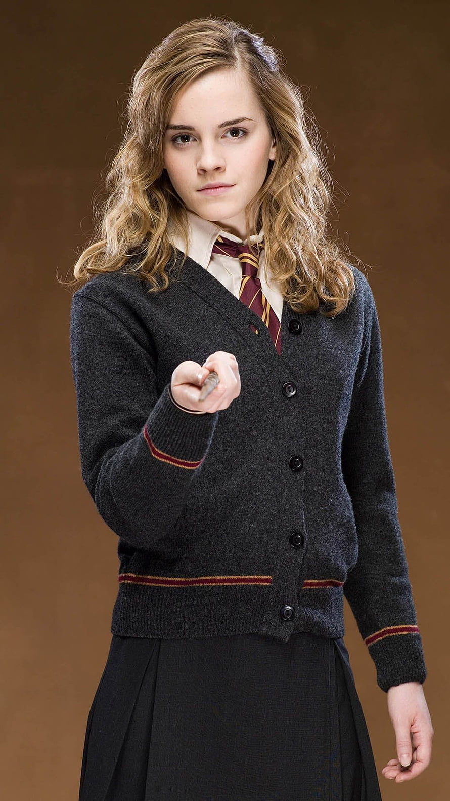 Hermione Granger in Hogwarts Uniform Holding a Wand HD phone wallpaper