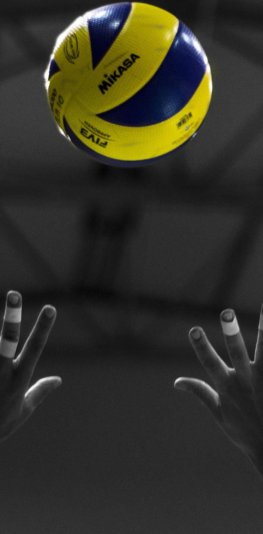 Mikasa Volleyball in Mid-Air with Hands Reaching Up in Dramatic Black and White Setting HD phone wallpaper