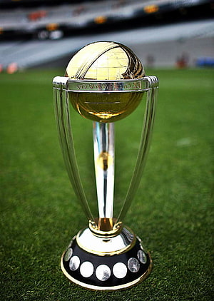 ICC Cricket World Cup Trophy on Green Pitch with Stadium Background HD phone wallpaper