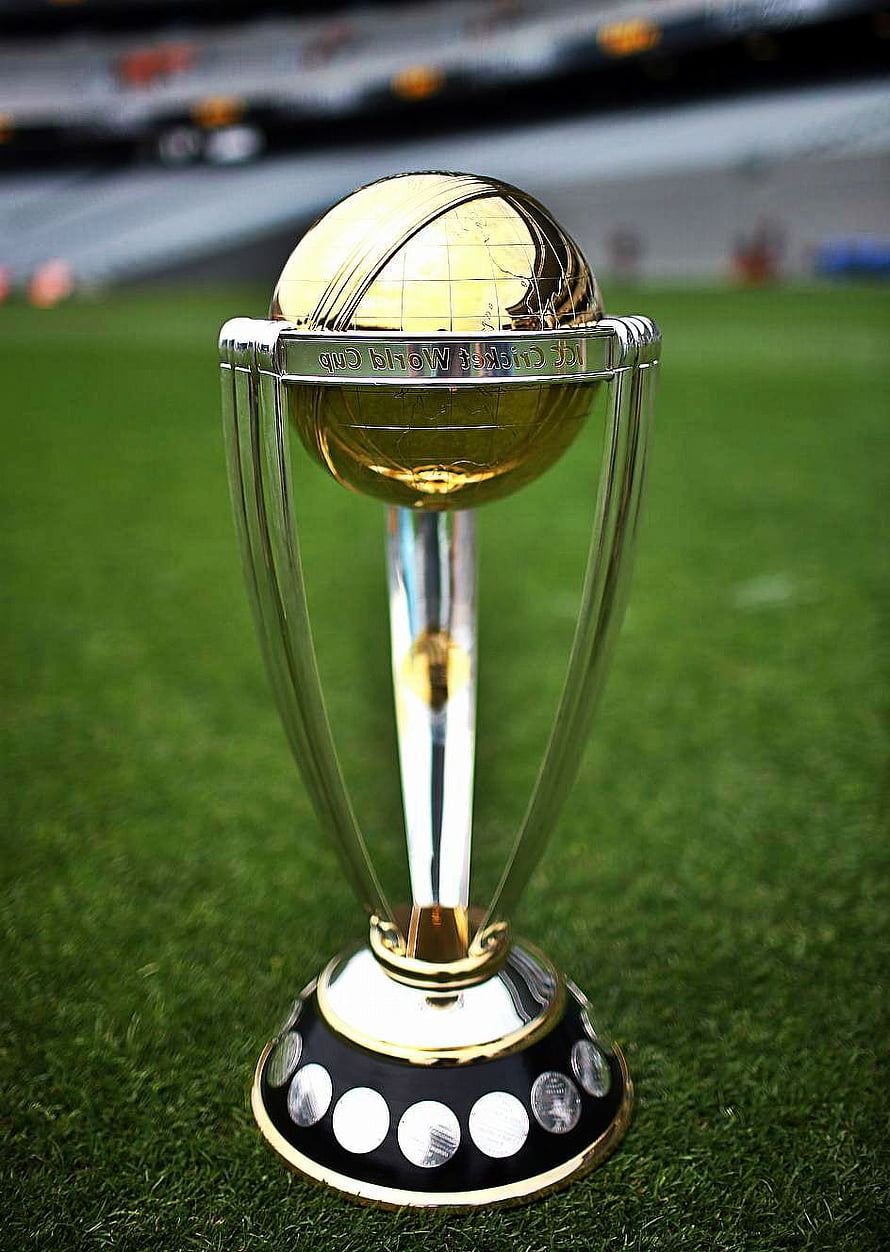 ICC Cricket World Cup Trophy on Green Pitch with Stadium Background HD phone wallpaper