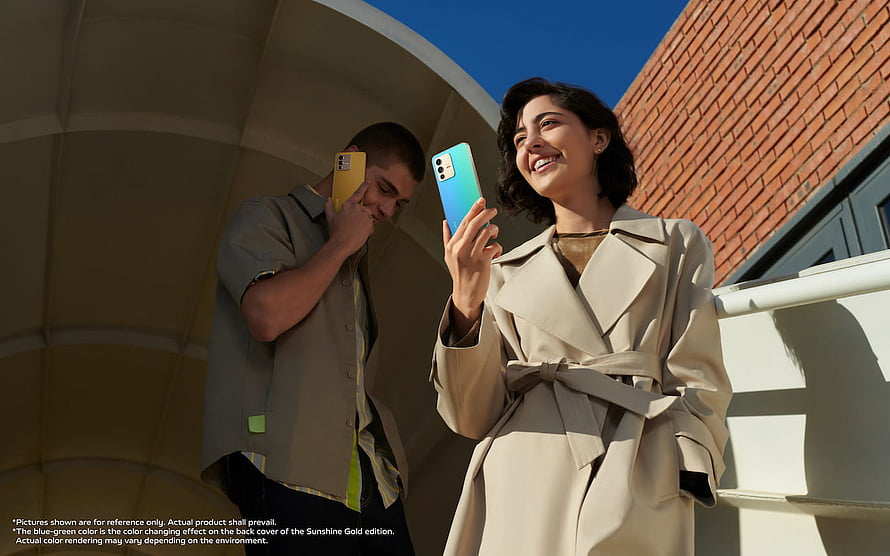 Young Couple Using Color-Changing Smartphones in Urban Setting HD wallpaper
