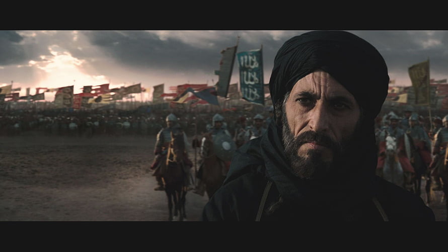 Saladin in a Cinematic Medieval Battle Scene with Armored Cavalry and Banners HD wallpaper