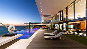 Modern Luxury Villa With Infinity Pool And Ocean View At Dusk HD wallpaper