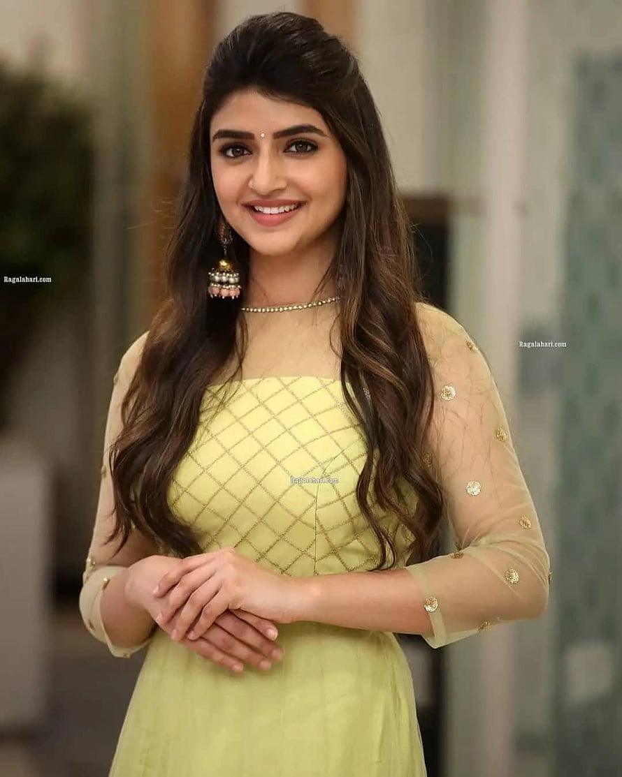 Pooja Hegde in a stunning yellow traditional outfit with intricate embroidery and elegant jewelry HD phone wallpaper