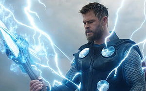 Thor wielding Stormbreaker with crackling blue lightning in dark armor HD wallpaper
