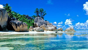Tropical Beach with Giant Granite Boulders and Turquoise Water HD wallpaper