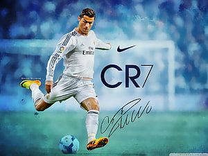 Cristiano Ronaldo in Real Madrid Kit Striking a Football on the Pitch HD wallpaper