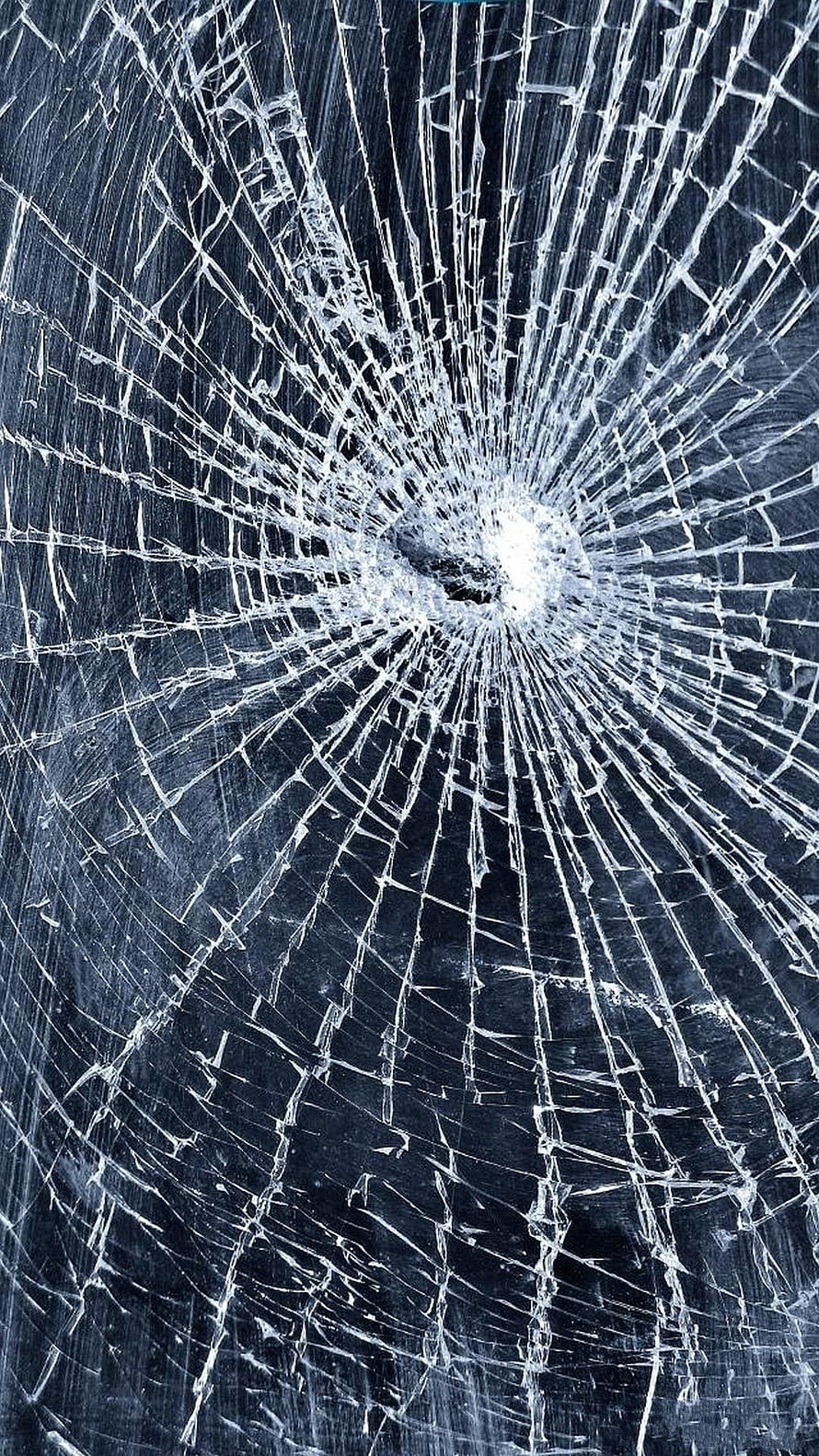 Shattered Glass Texture with Radiating Fracture Lines on Dark Blue Background HD phone wallpaper