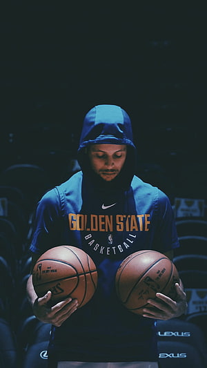 Stephen Curry in Golden State Basketball Hoodie Holding Two Signed NBA Basketballs HD phone wallpaper