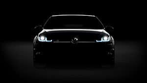 Volkswagen Golf R Front View with Illuminated Headlights in Dark Studio Setting HD wallpaper