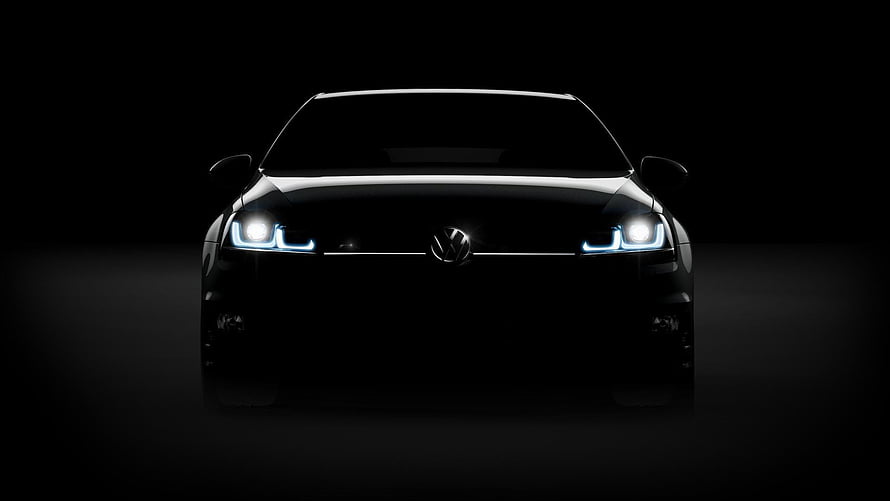 Volkswagen Golf R Front View with Illuminated Headlights in Dark Studio Setting HD wallpaper