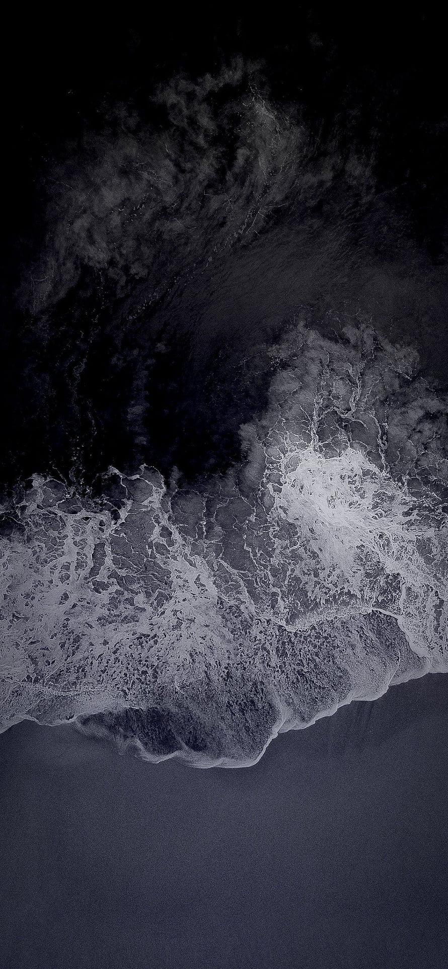Aerial View of Dark Ocean Waves Crashing on Shore in Monochrome HD phone wallpaper