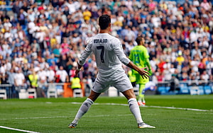 Cristiano Ronaldo in Real Madrid Kit Preparing for a Free Kick on the Pitch HD wallpaper